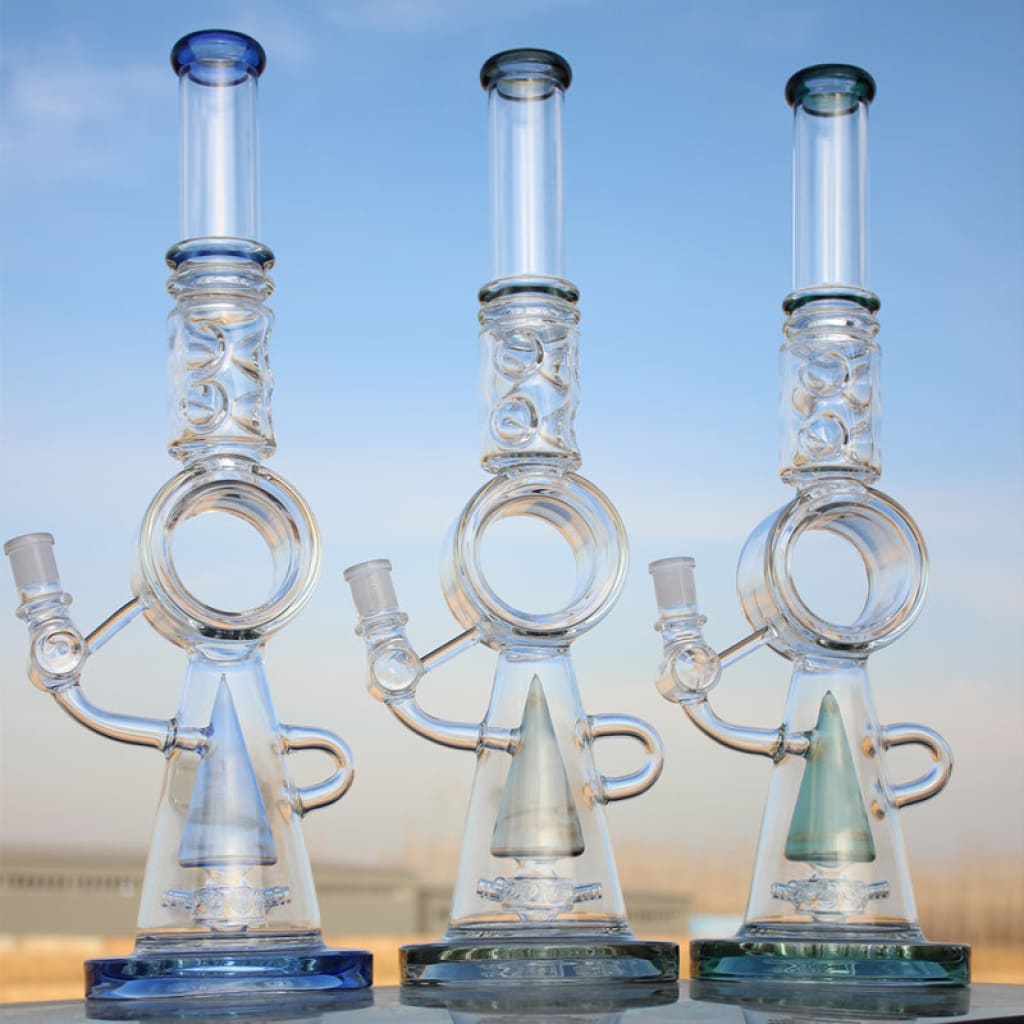 Three glass water pipes with donut percolators and conical bases for smooth filtration