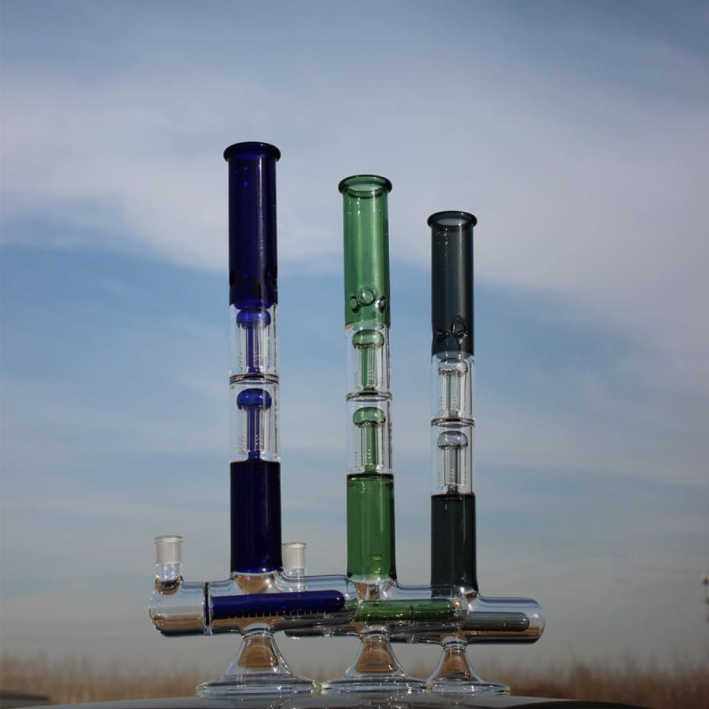 Dual arm percolated glass water bong in blue, green, and black with a shared base