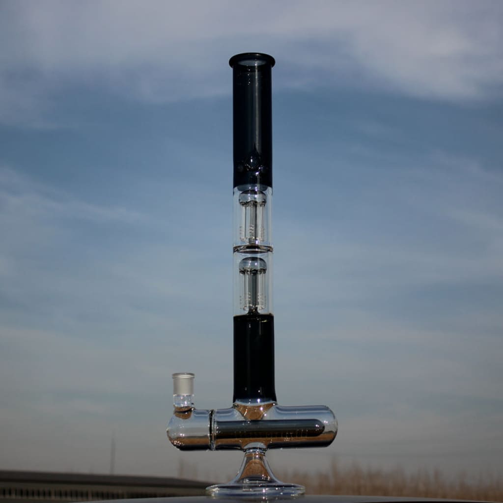 Dual arm percolated glass water pipe with metal base and tall cylindrical chamber