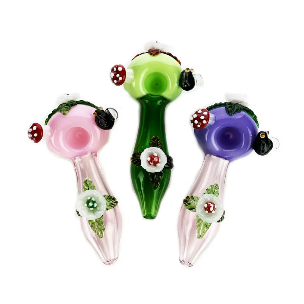 Three colorful glass pipes featuring Flower Mushroom Art in a Mushroom Art Hand Pipe Spoon design