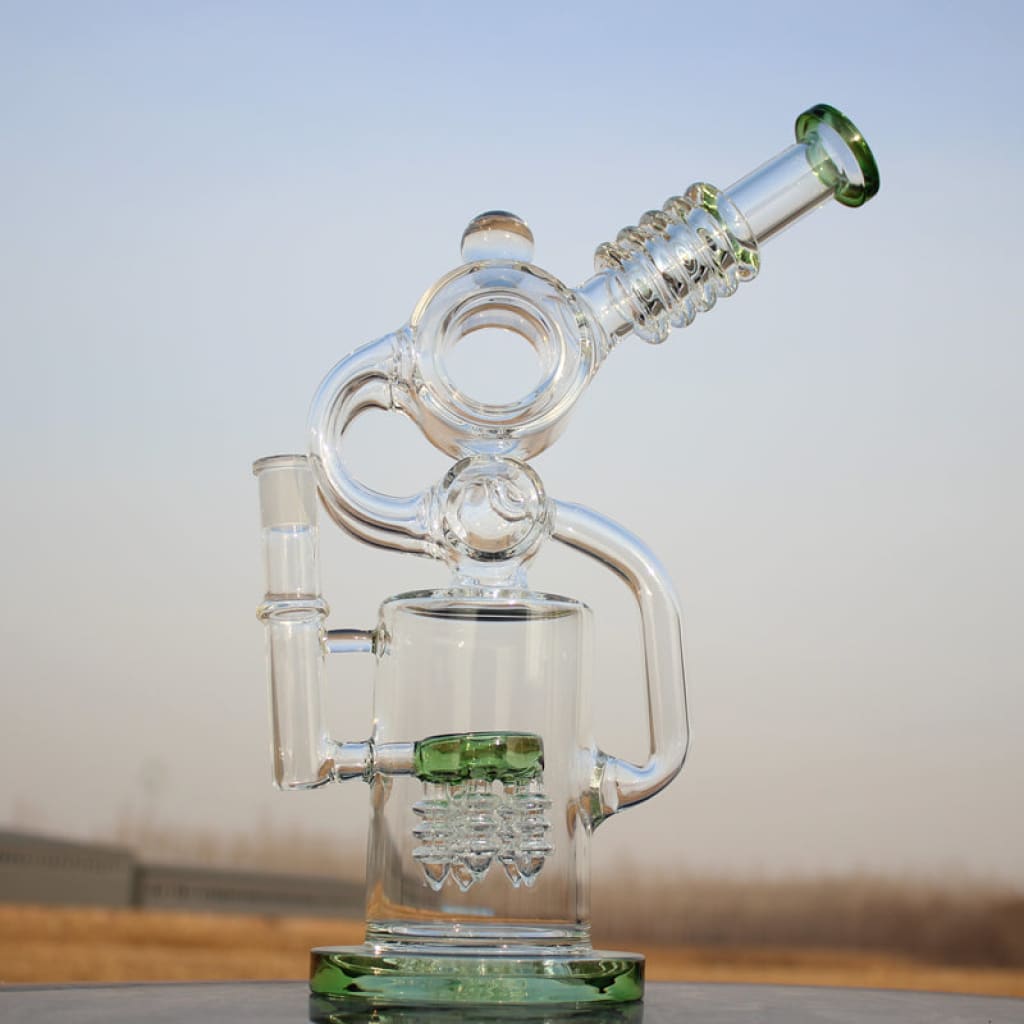 Intricate Glass Ergonomic Recycler Style Water Pipe With Green Accents And Angled Mouthpiece