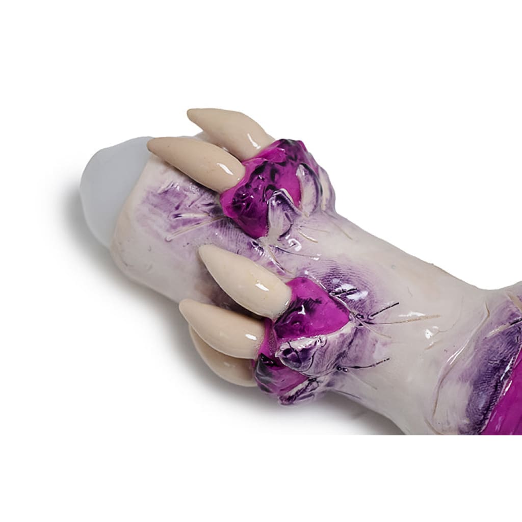 White candle with purple drippings and ribbons for Glass Monster Teeth Handpipe