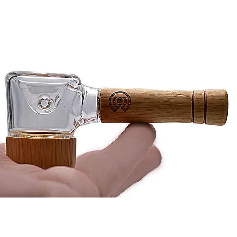 Glass and bamboo smoking pipe featured in Connect Natural Wood Spoon Pipe for eco-conscious collectors