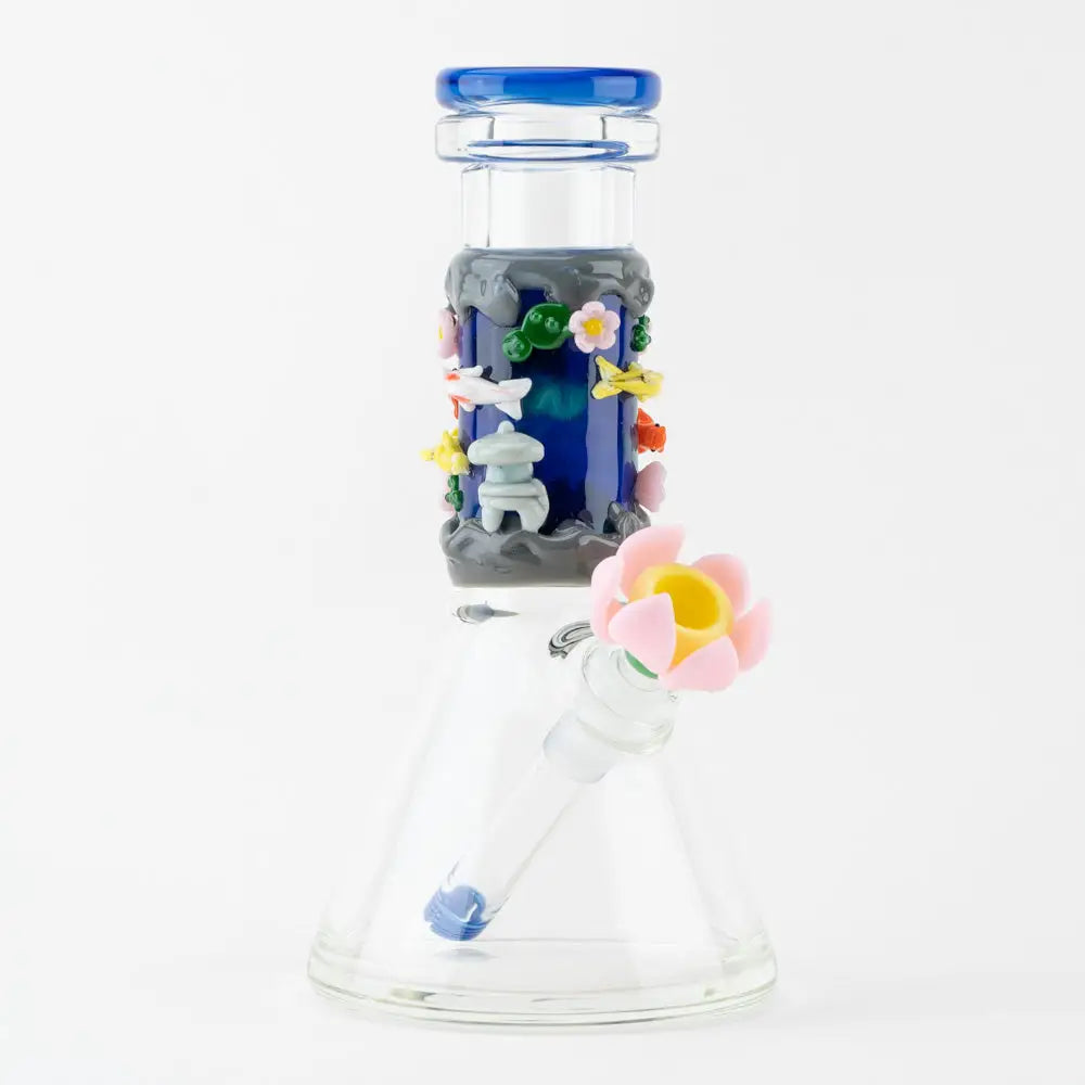 Empire Glassworks Baby Beaker Koi Pond bong with blue tint and figurines