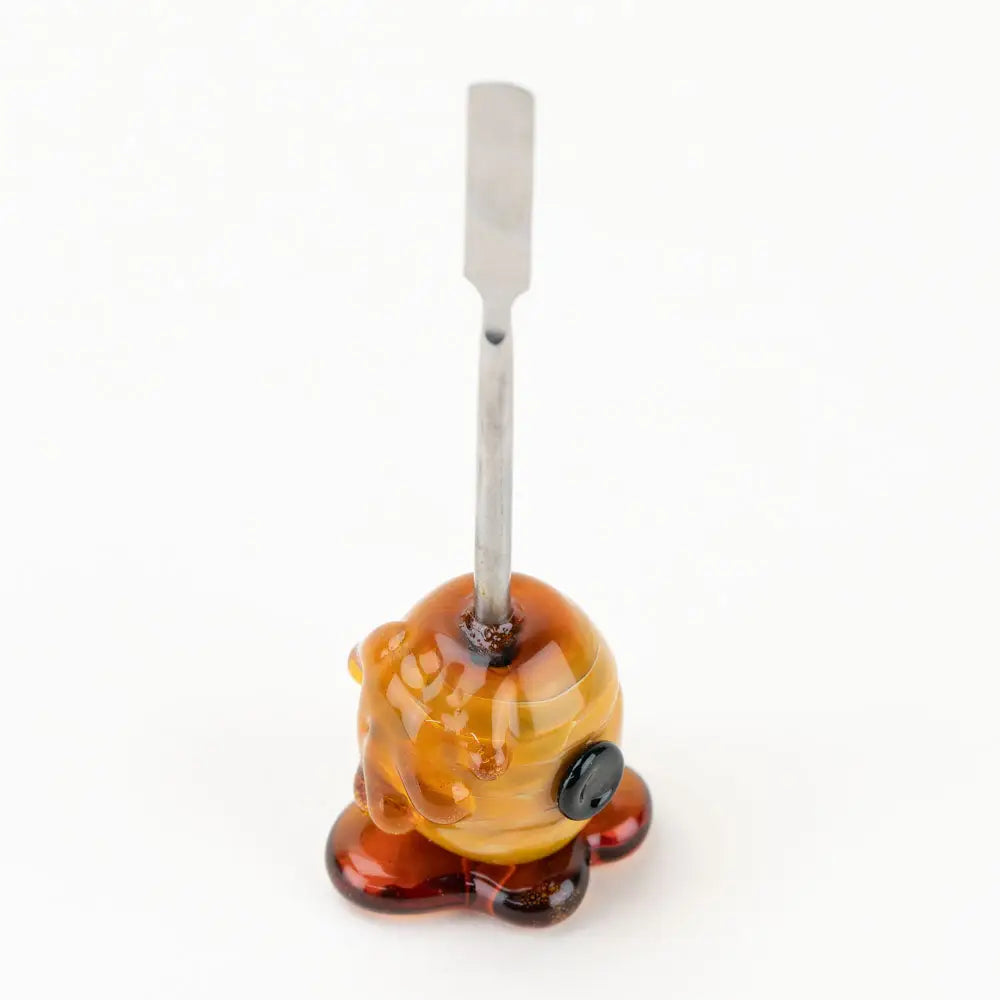 Empire Glassworks beehive dab tool in borosilicate glass, amber honeycomb design