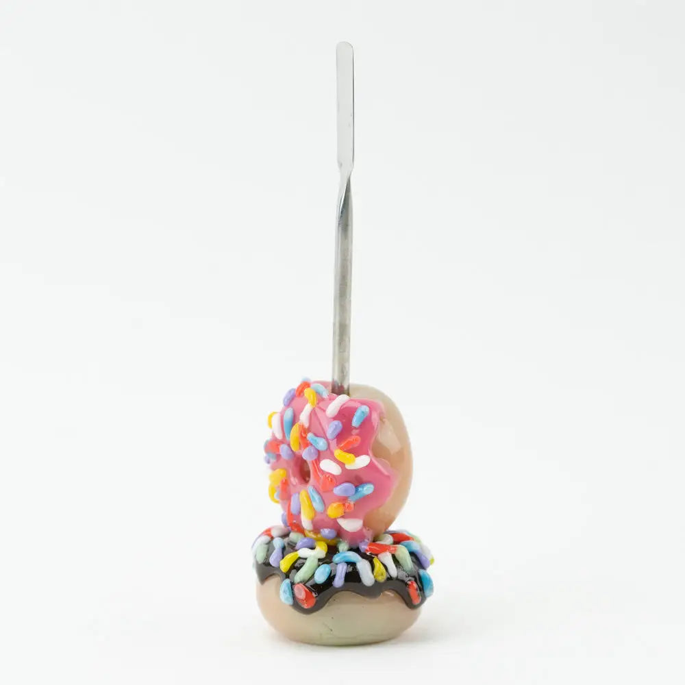 Empire Glassworks donut dab tool in borosilicate glass with pink frosting and rainbow sprinkles