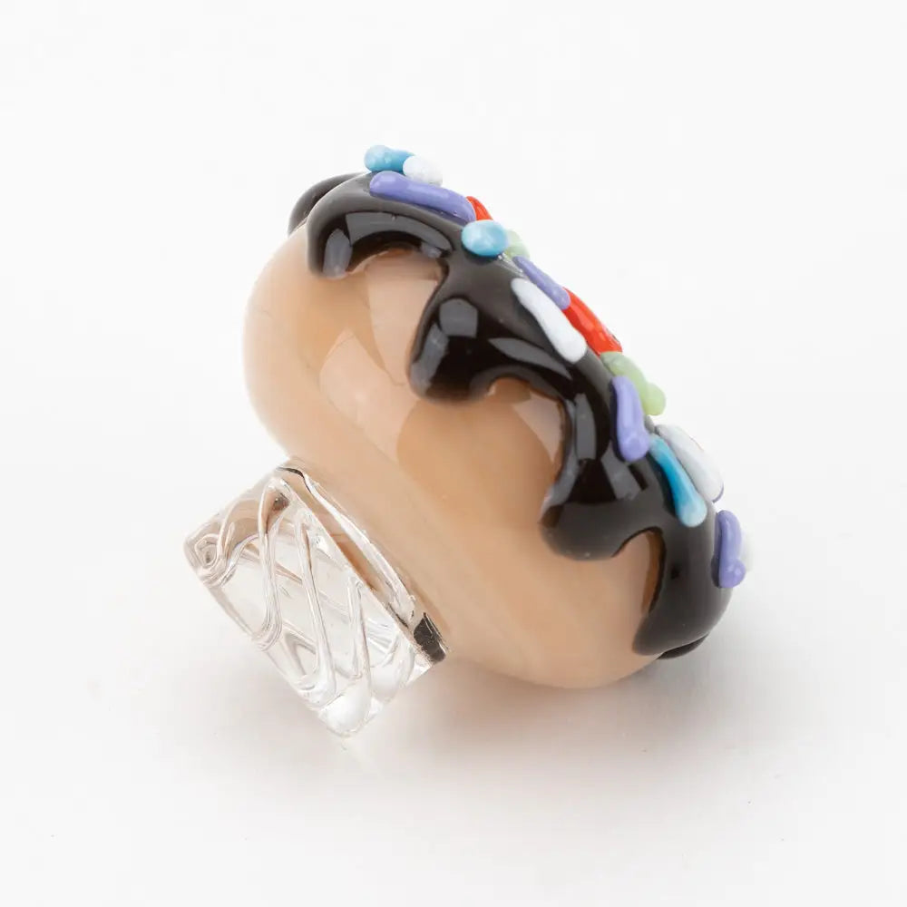 Empire Glassworks donut spinner carb cap with beige glass, chocolate drizzle, sprinkles