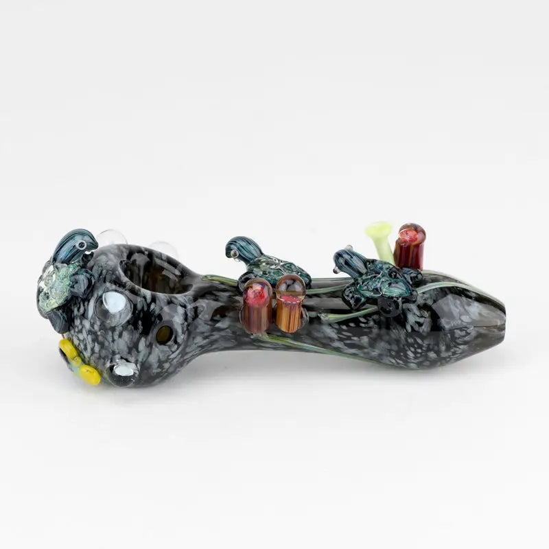 Empire Glassworks East Australian Current spoon pipe with colorful marbled glass figurines