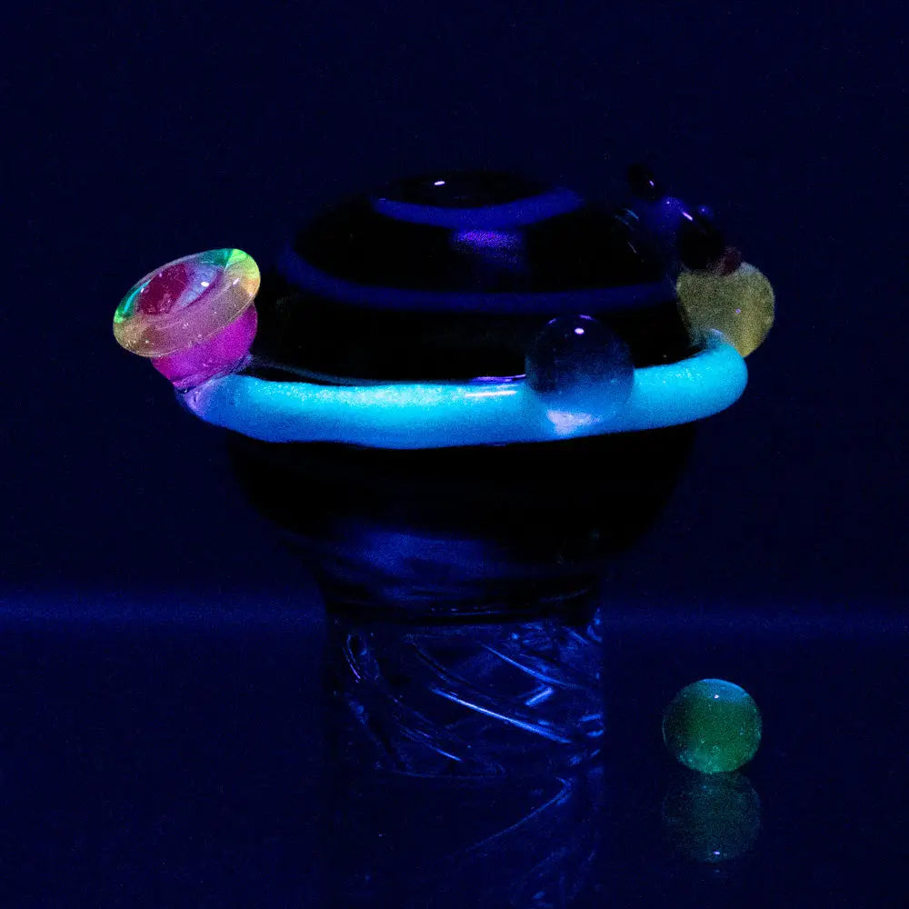 Empire Glassworks Galactic Spinner Carb Cap with glowing blue ring