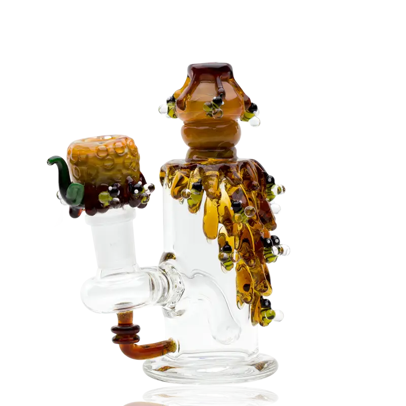 Empire Glassworks mini dab rig with beehive amber honeycomb motifs