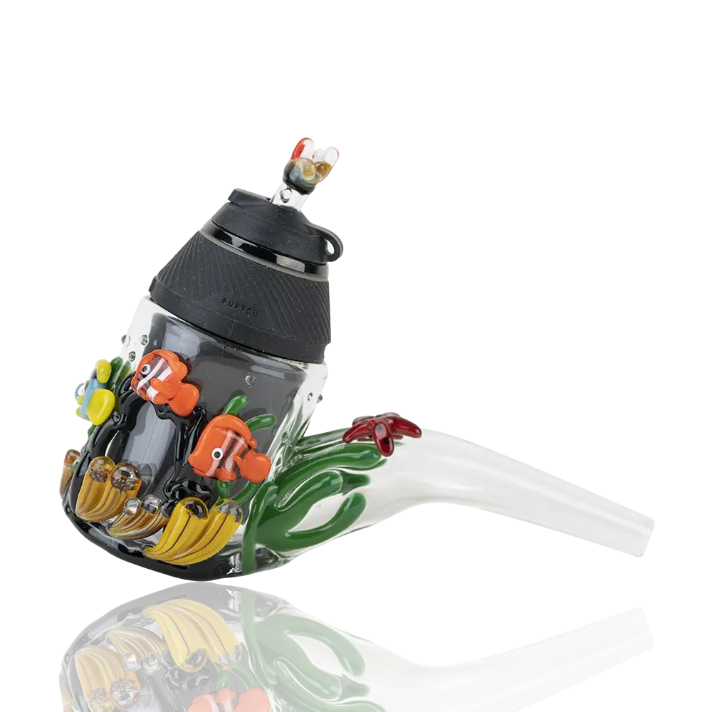 Empire Glassworks Puffco Proxy Attachment with clear glass bottle, black lid, and colorful hand-blown fish coral decorations