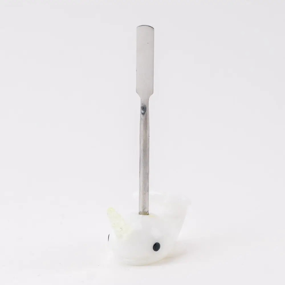 Empire Glassworks Radioactive Narwhal dab tool with white ceramic whale holder and silver spatula