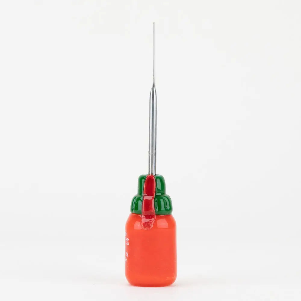 Empire Glassworks Sriracha dab tool in borosilicate glass, orange pepper rig