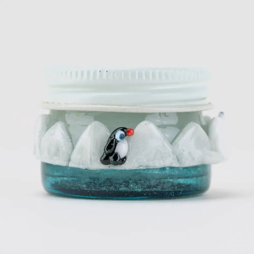 Empire Glassworks Terp Jar Avenge the Arctic with blue glitter penguin