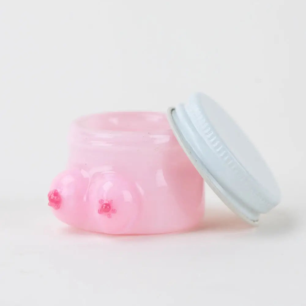 Pink Empire Glassworks terp jar with boobies design and translucent plastic body