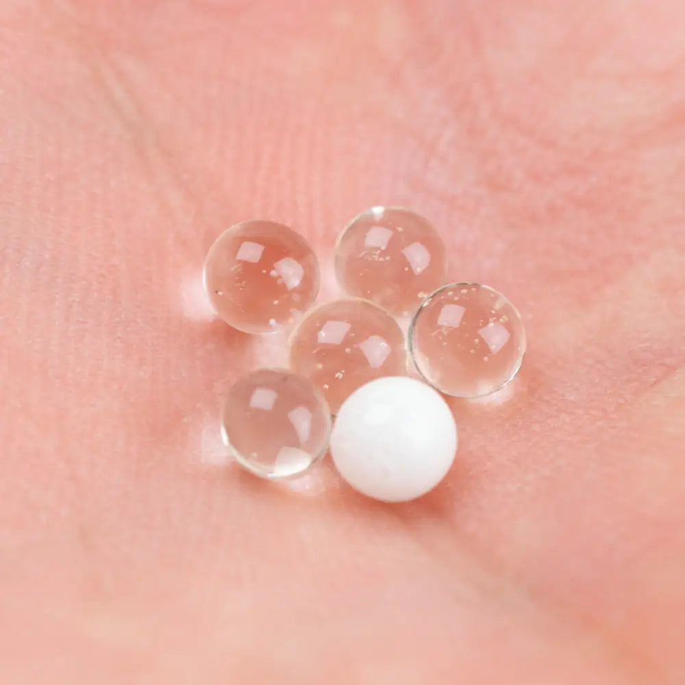 Empire glassworks terp pearls 4mm uv pearls on pink surface