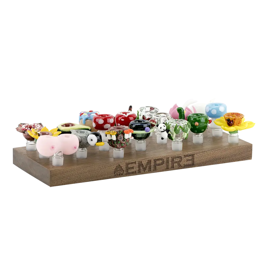 Colorful hand-blown glass bowl pieces in Empire wooden bowl piece display