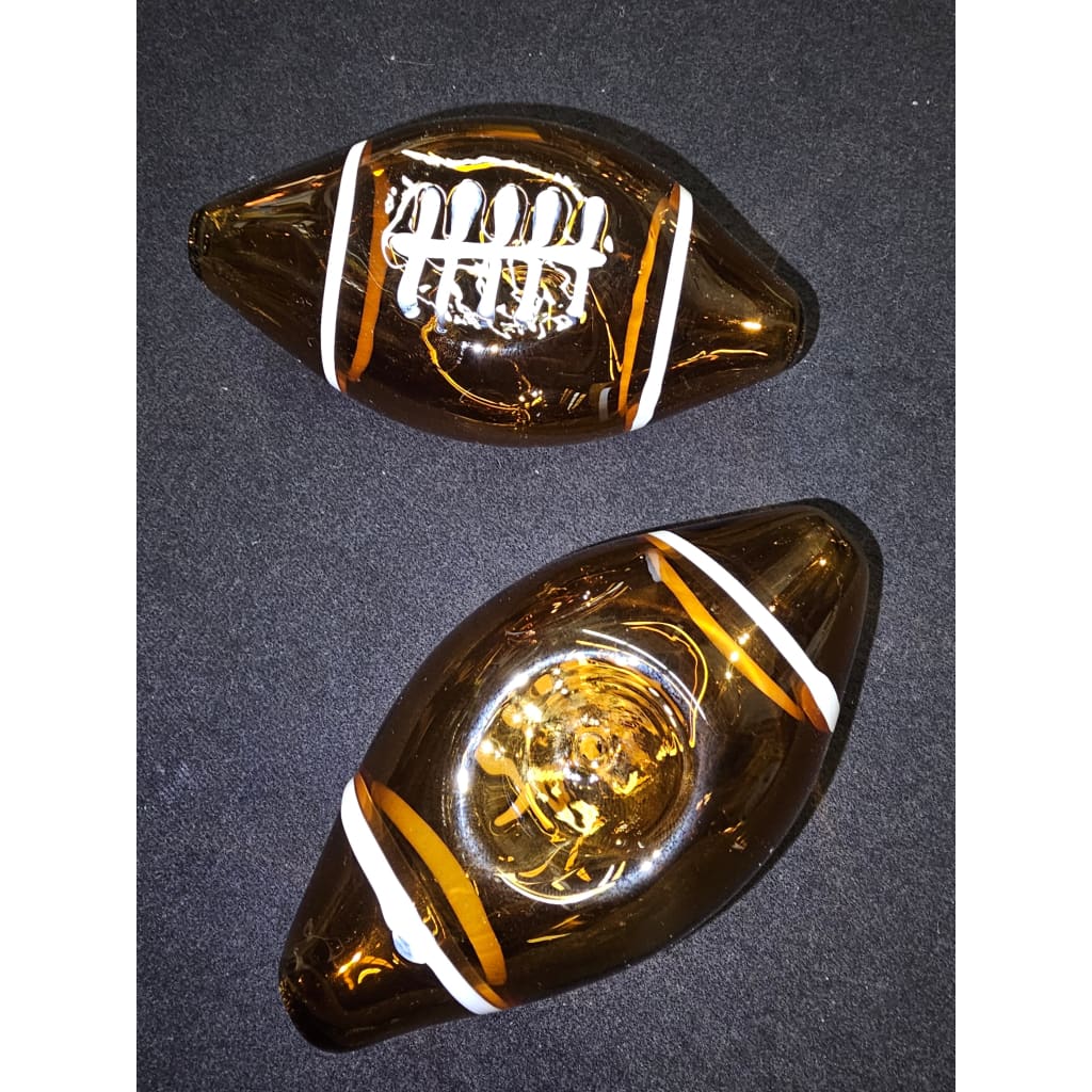 Football-themed glass handpipe with decorative designs perfect for game days