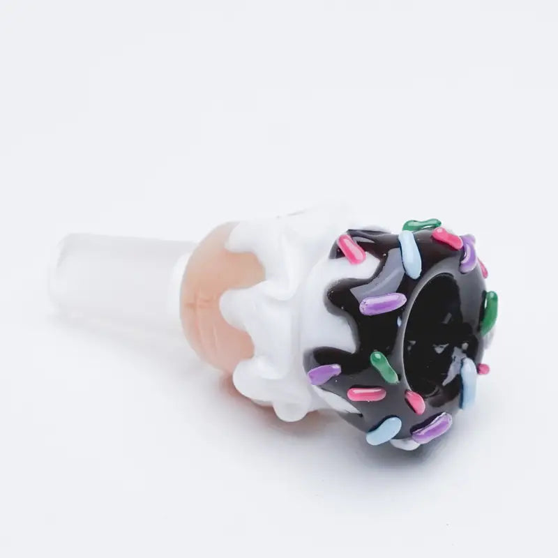 Ice cream cone bowl piece with black icing, frosting drips, rainbow sprinkles