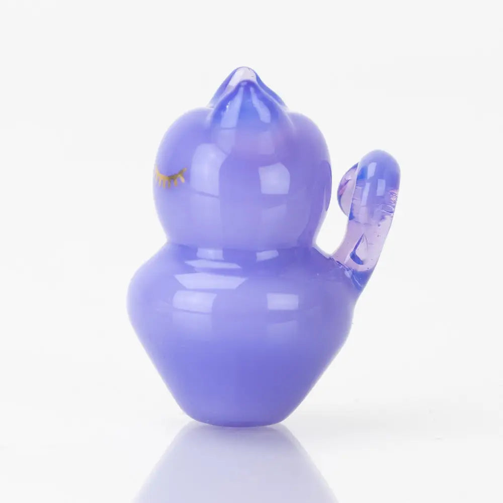 Translucent lavender Sakibomb kitty carb cap figurine of sleeping cat