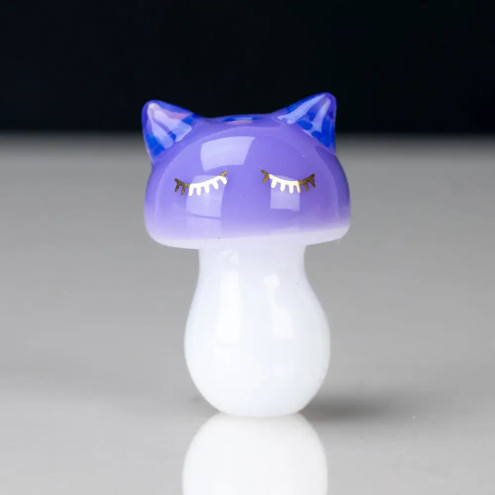 Glossy purple sakibomb kitty head carb cap with blue ears and gold lashes