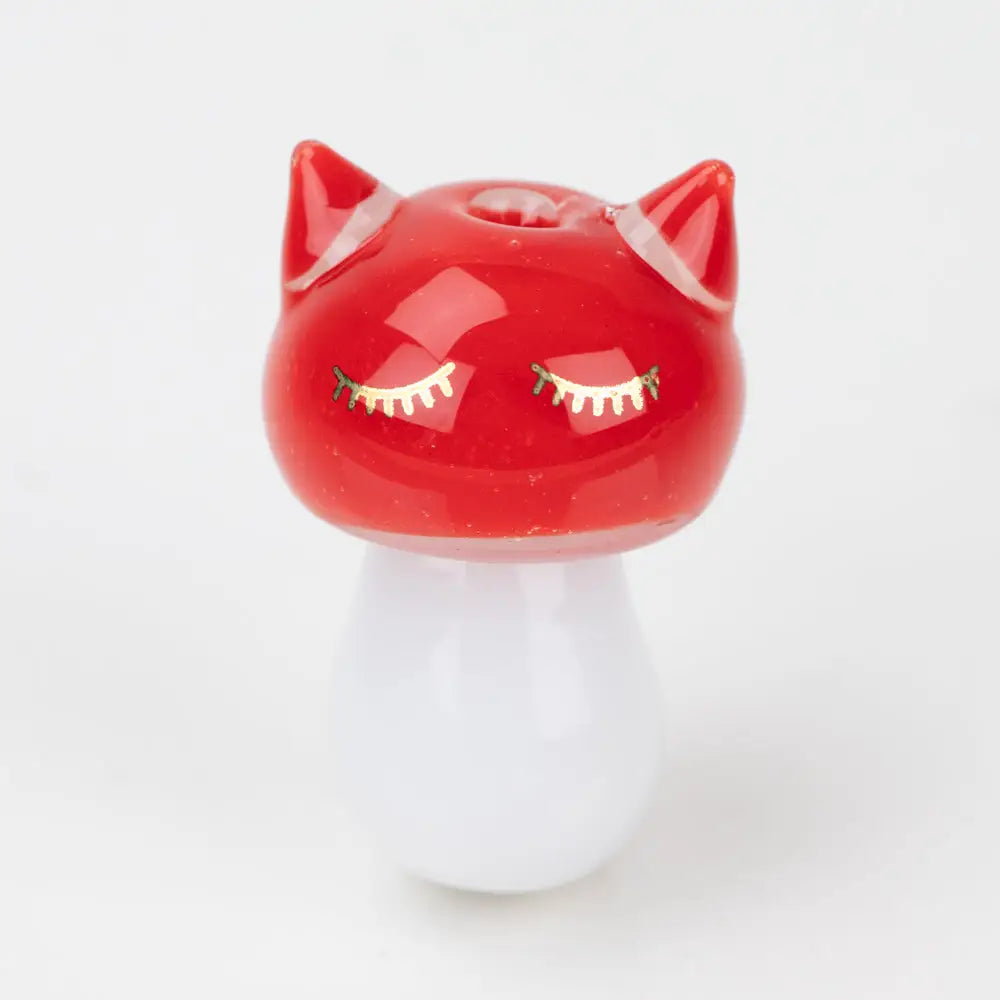 Glossy red Sakibomb Kitty Head carb cap with cat ears and gold lashes