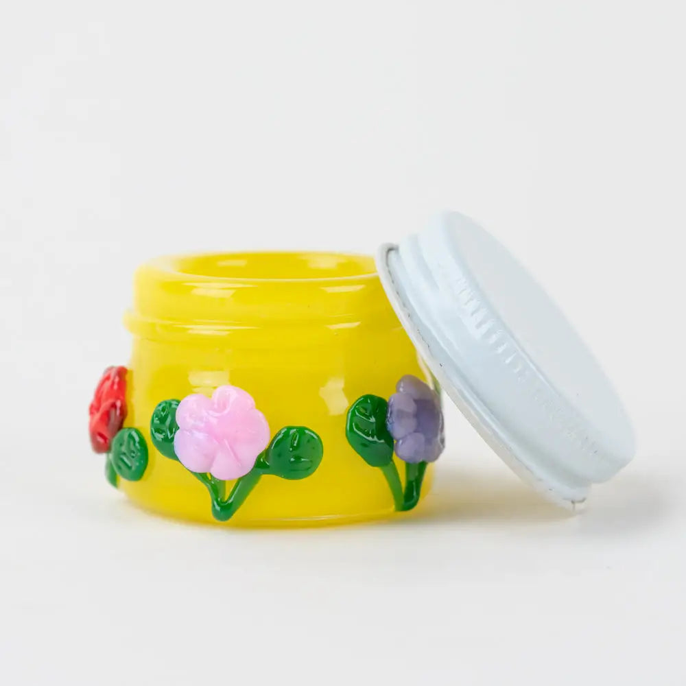 Sunshine Garden terp jar by Empire Glassworks with yellow glass and floral design