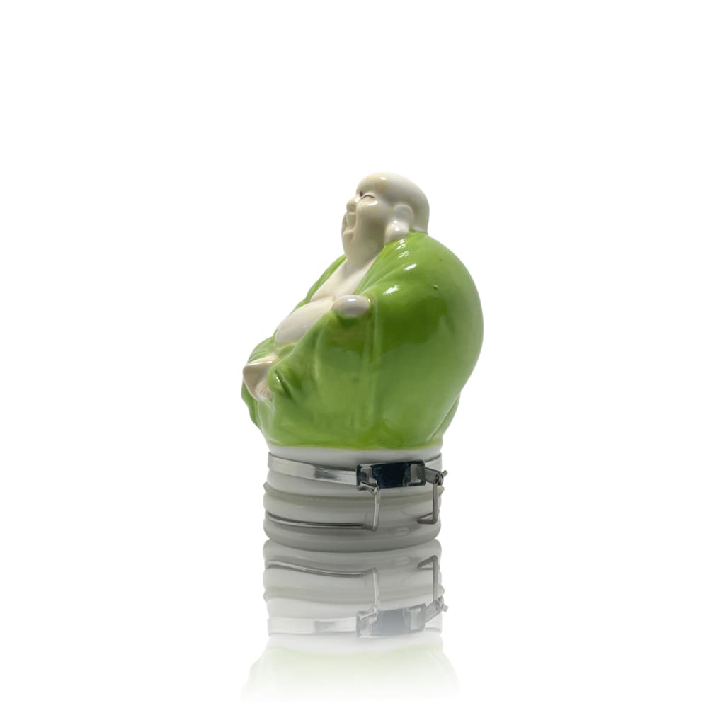 Ceramic figurine in green robes on light bulb base, perfect for ceramic storage jars in elegant home decor
