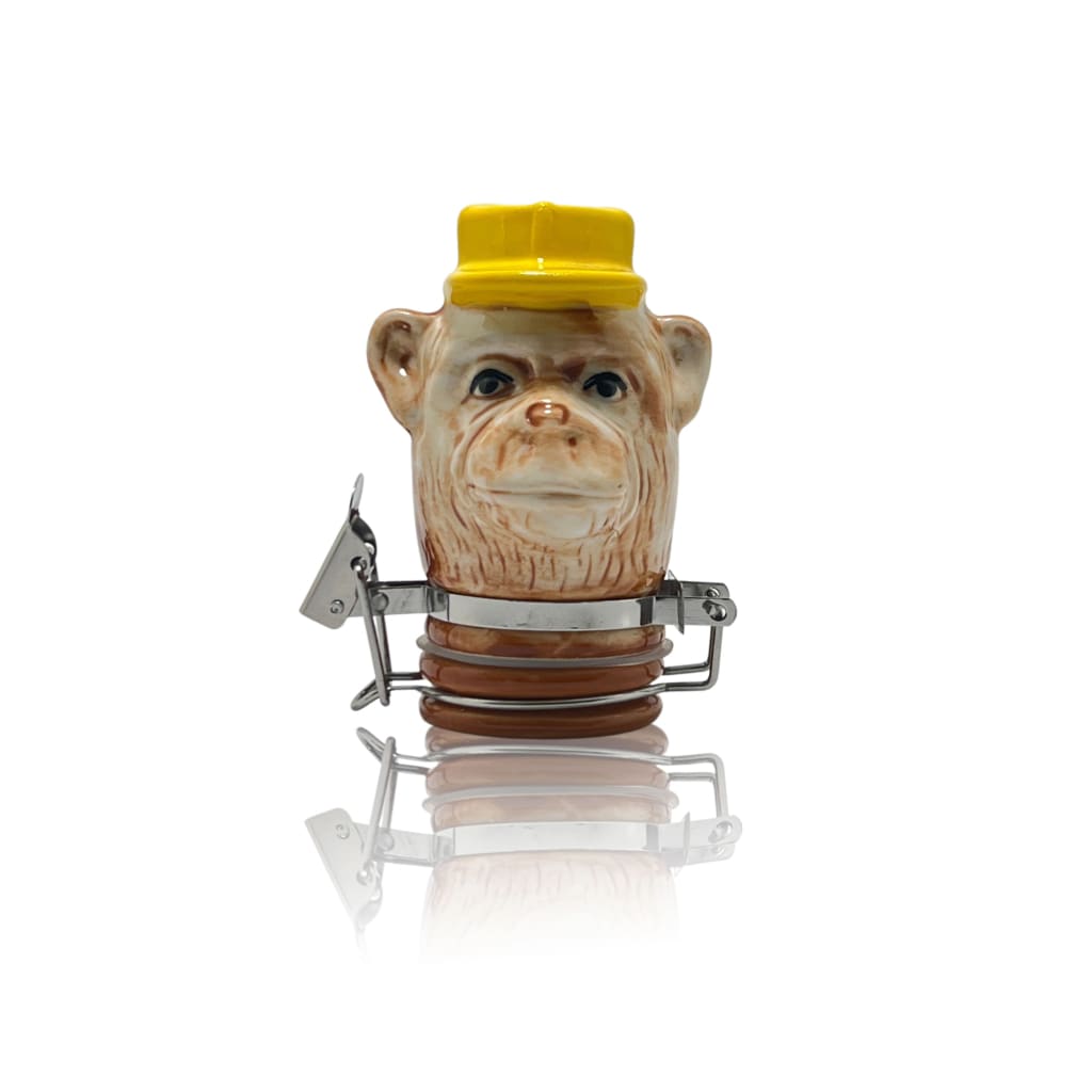 Monkey-shaped ceramic storage jar with yellow cap for elegant home decor