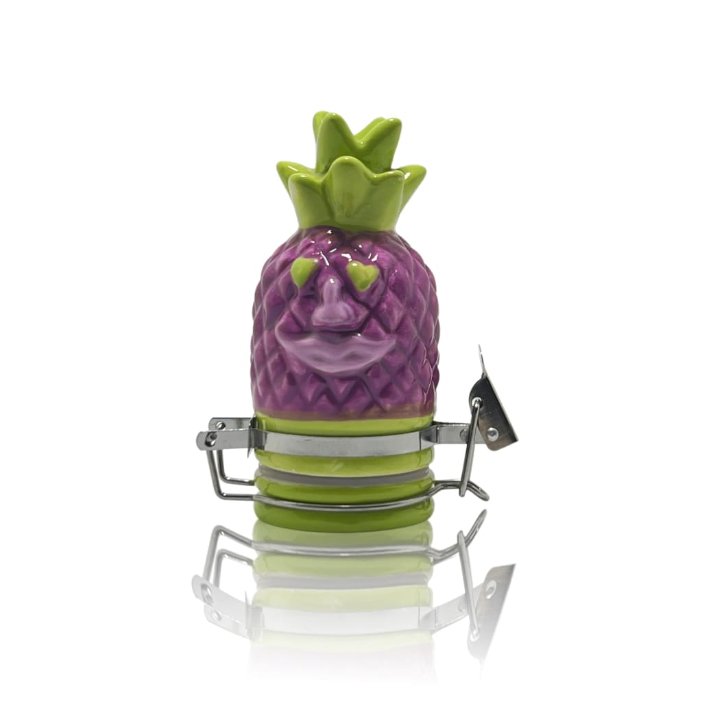 Whimsical purple pineapple-shaped character adorning ceramic storage jars for elegant home decor