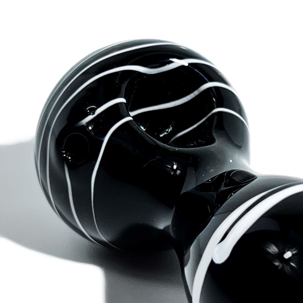 Glossy solid black spoon pipe with white stripes wrapped around the sleek ceramic structure