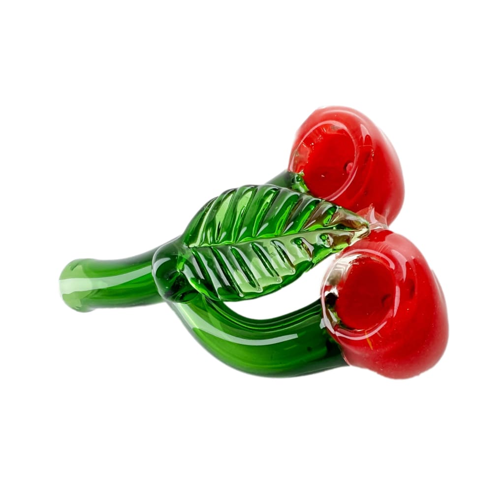 Glass cherry hand pipe with green stem and leaves displayed with rubbing alcohol formula