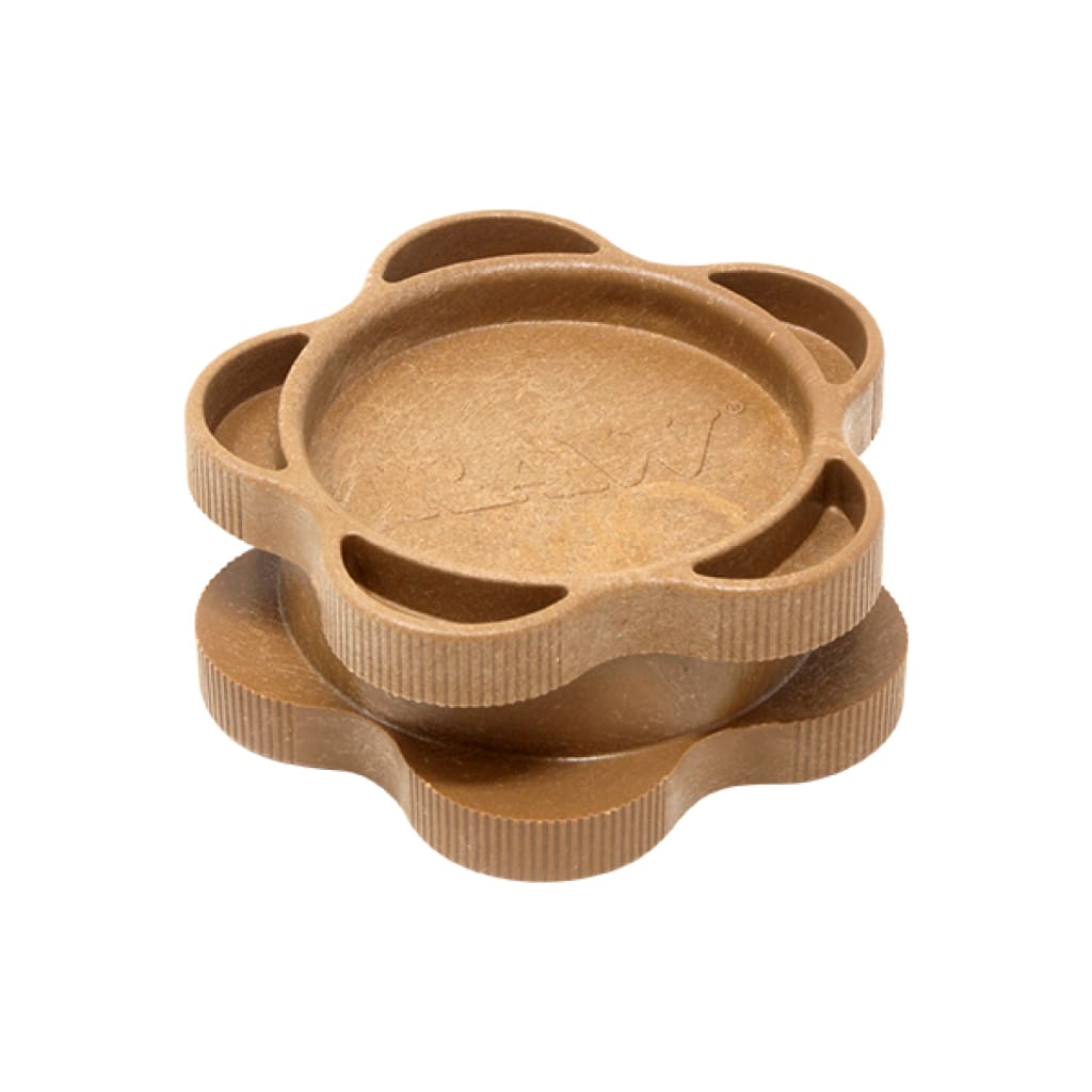Flower-shaped tan herb grinder with ridged edges, perfect for Raw Cone Cutter relights