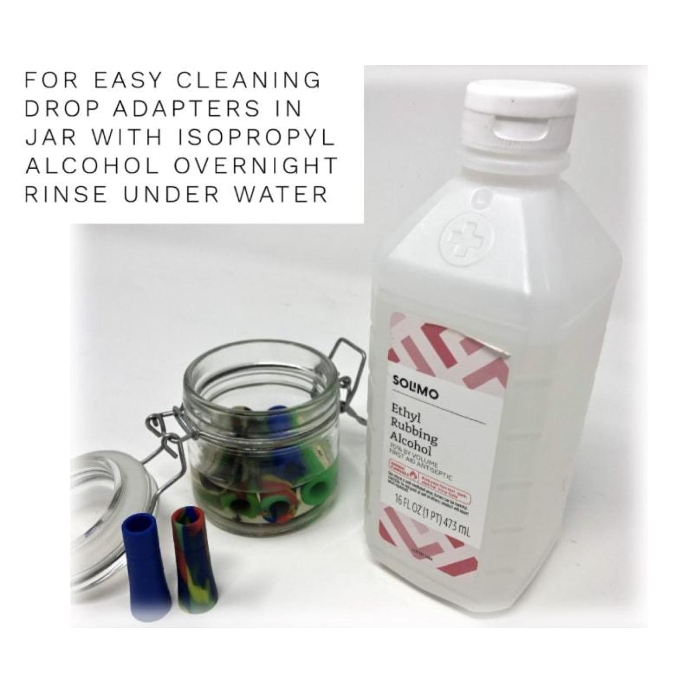 Bottle of Solimo ethyl rubbing alcohol next to jar of colorful filter weed pipe adapters