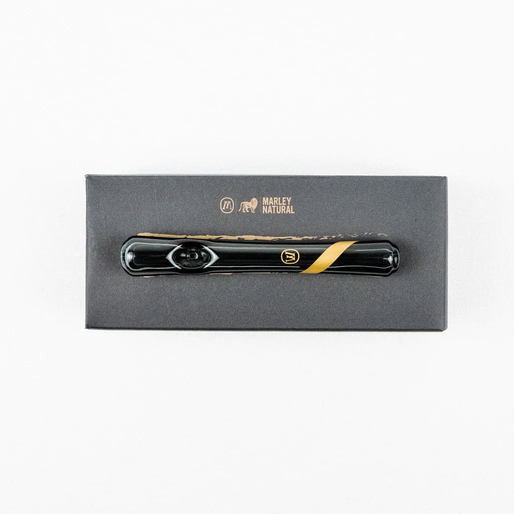 Sleek black vaporizer pen on Marley smoked glass steamroller box with gold stripe design