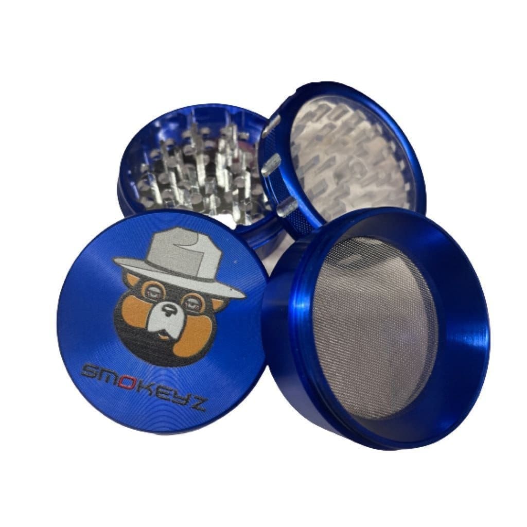 Blue smokey metal grinder with cartoon bear lid, clear lid, best weed grinders