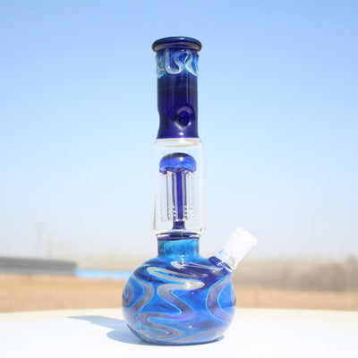 10.5’ Blue Buddha Glass Water Pipe W/ Coil Perc and intricate, swirling blue patterns