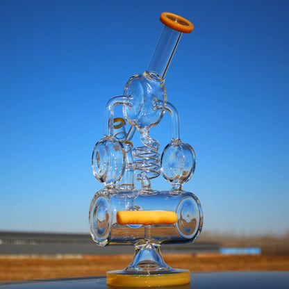 Elaborate glass bong featuring Recycler Style Inline and Spring Body Shape design