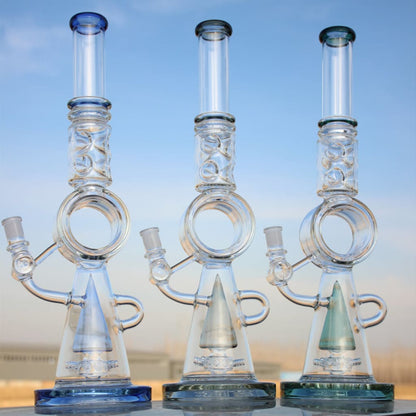 Three glass water pipes with donut percolators and conical bases for smooth filtration