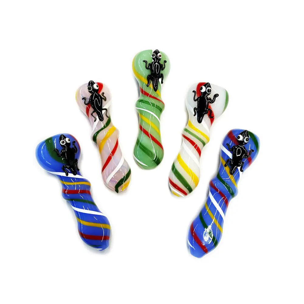 Colorful glass hand pipe with frog design and slime color detail