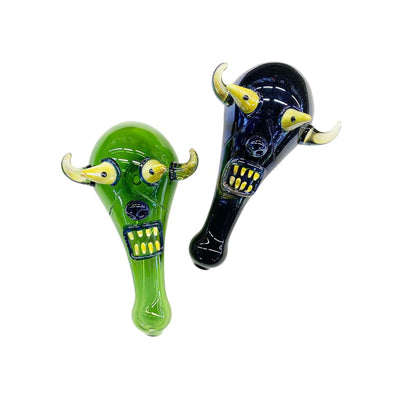 Devil hand pipe with bold 2D art; monstrous face designs featuring horns and teeth