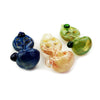 Marble art glass hand pipe with four holes in blue, cream, and green color variations