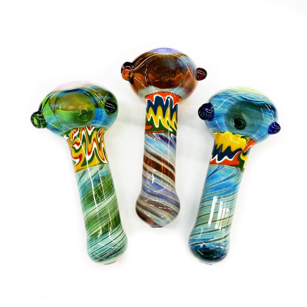 Three swirling reversal glass bongs with vibrant honeycomb designs
