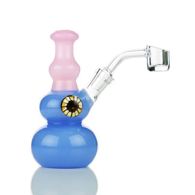 Blue and pink glass dab rig with eye design featuring double sphere design and locket 14mm banger