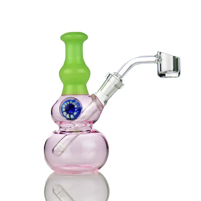 Pink and green glass dab rig with double sphere design and locket 14mm banger