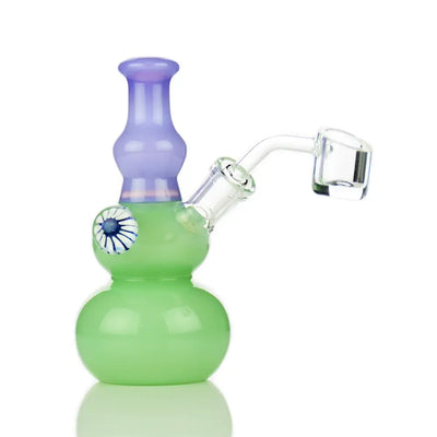 Green and purple glass dab rig with double sphere design and locket 14mm banger