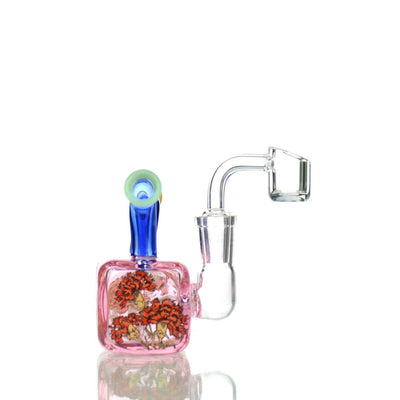 Glass water pipe rig with pink base, double mouthpiece, and 14mm male banger