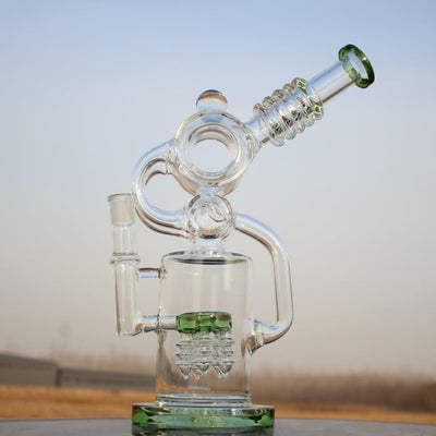 Intricate Glass Ergonomic Recycler Style Water Pipe With Green Accents And Angled Mouthpiece