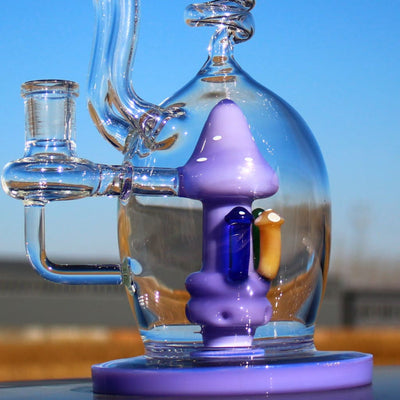 Glass water pipe with purple mushroom percolator and circ perc for mushroom recycler water