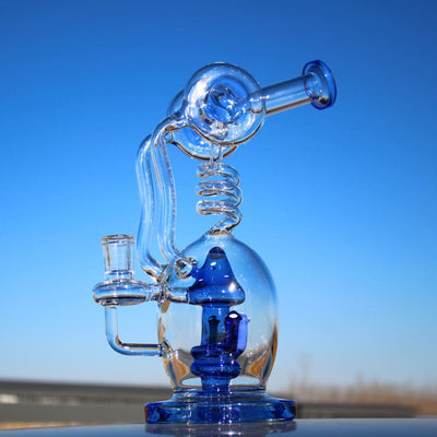 Mushroom recycler water pipe with intricate glass, spiral, blue accents, and circ perc